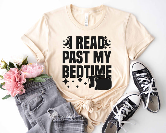 A natural color shirt with the saying "I read past my bedtime"