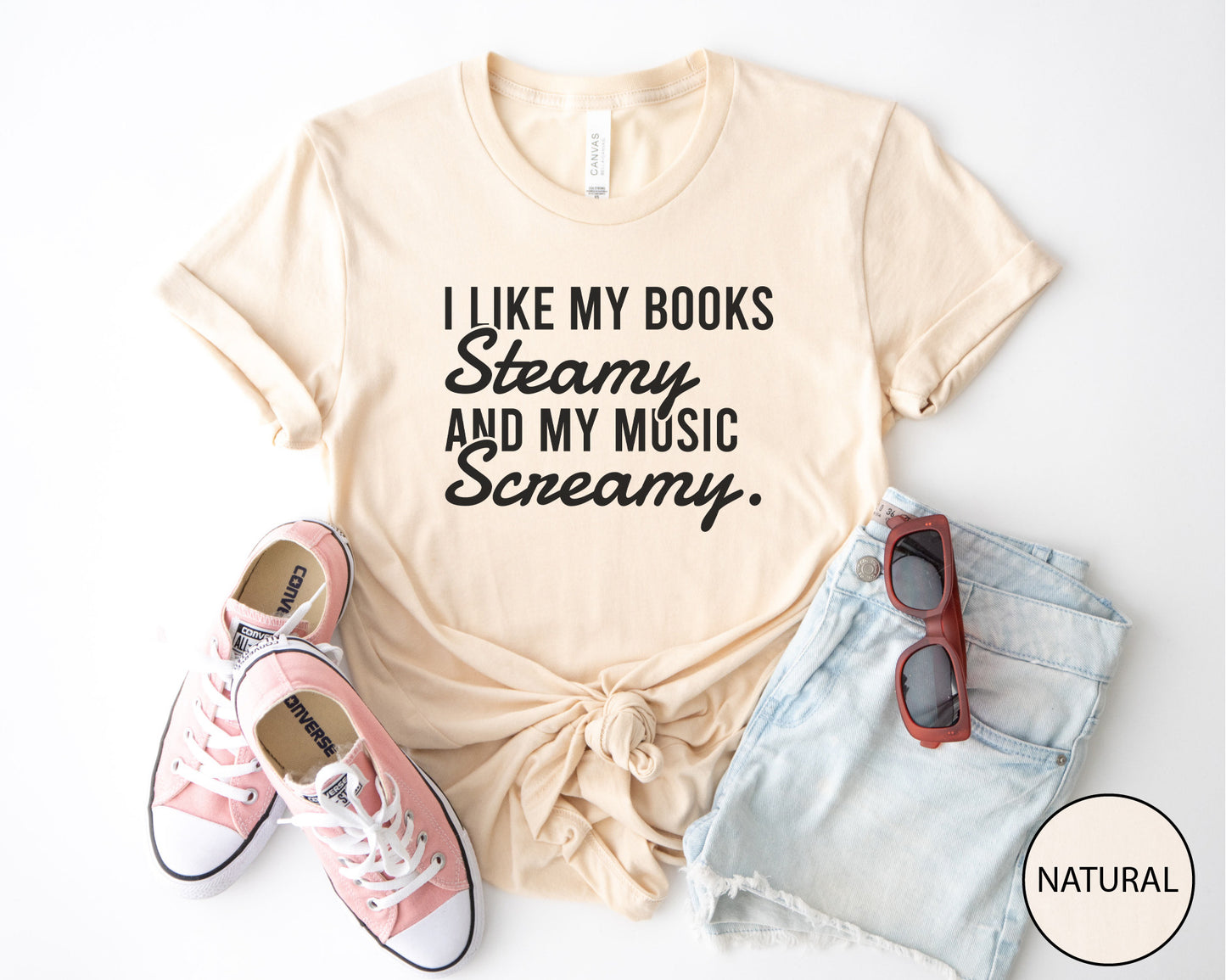 Natural t-shirt with text, pink sneakers, denim shorts, and sunglasses on a white background