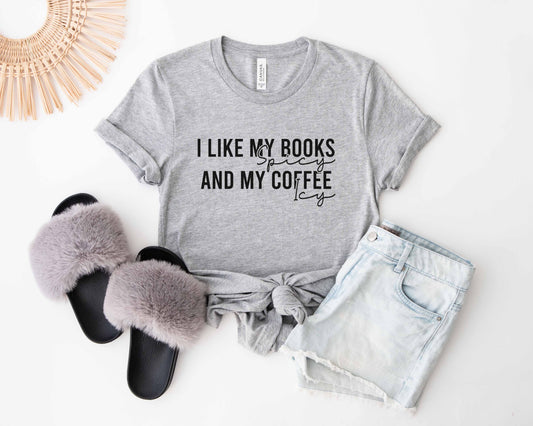 An athletic heather color with the saying "I like my books spicy and my coffee icy"