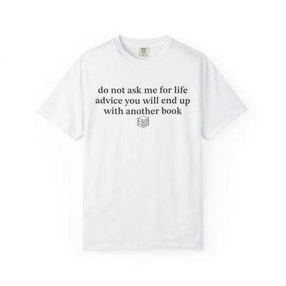 A white short-sleeve crewneck t-shirt with black printed text on the chest that reads 'do not ask me for life advice you will end up with another book' above a small book icon, shown on a plain white background.