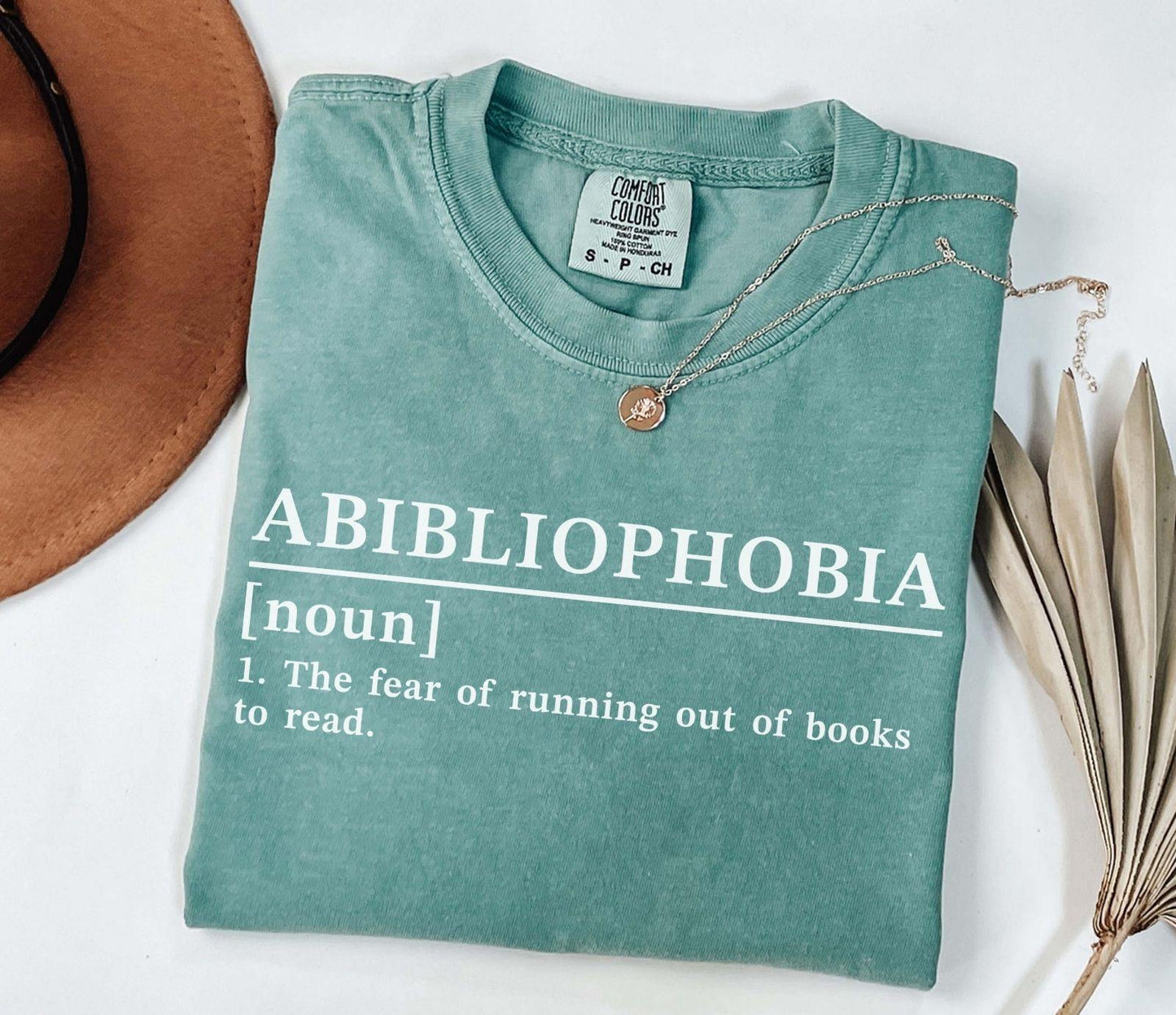 A comfort colors® shirt with the saying "Abibliophobia"