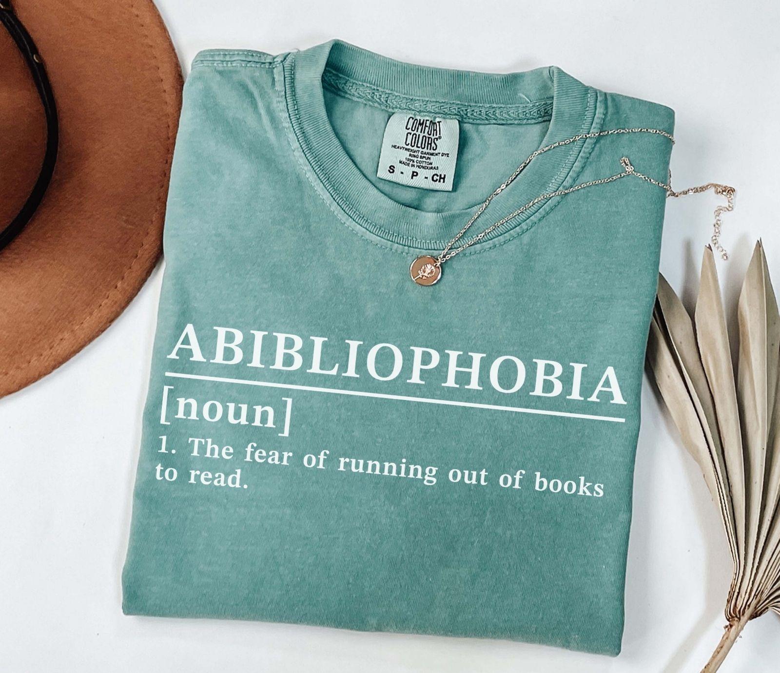 A comfort colors® shirt with the saying "Abibliophobia"