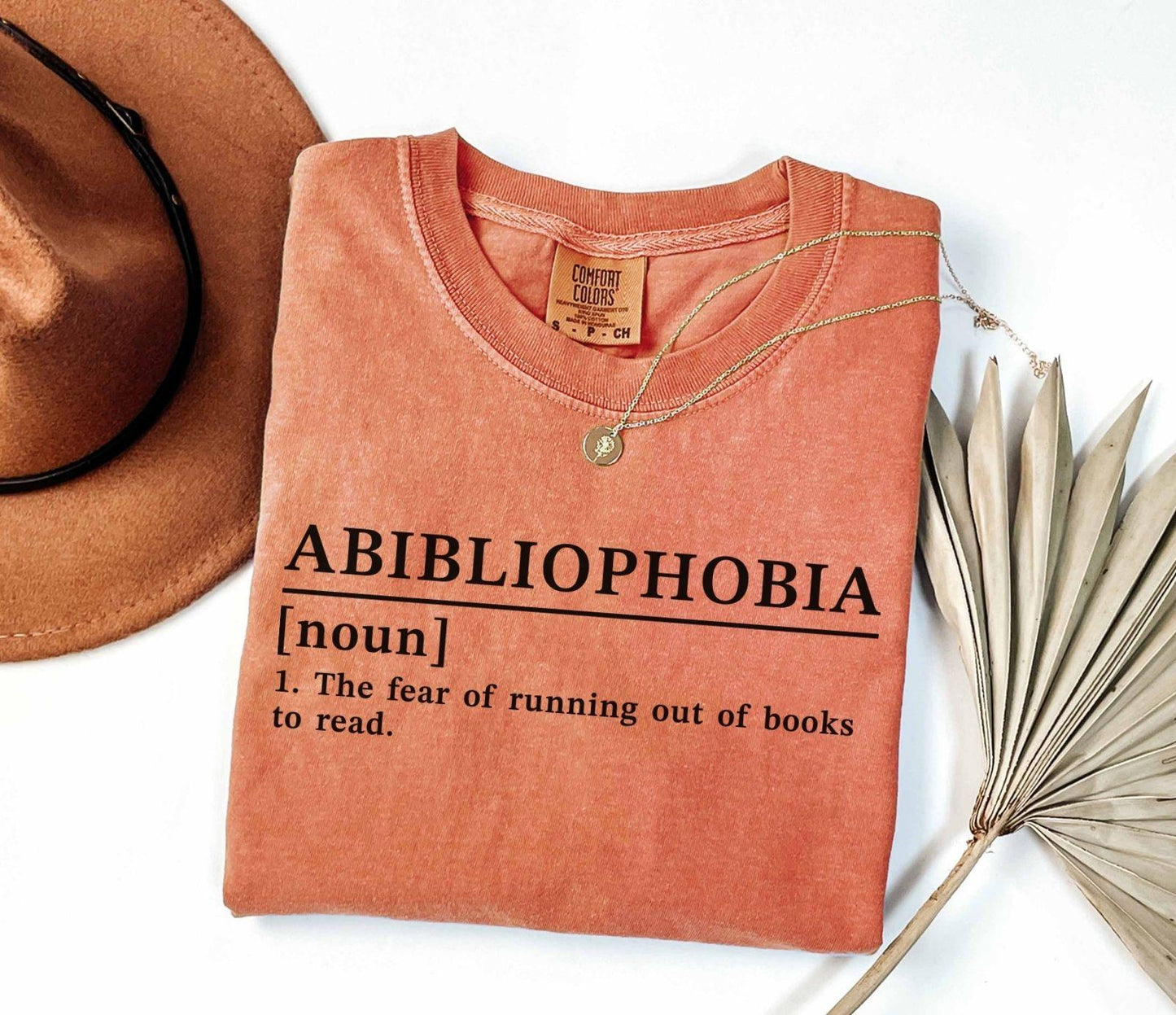 A comfort colors® shirt with the saying "Abibliophobia"