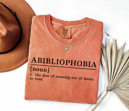 A comfort colors® shirt with the saying "Abibliophobia"