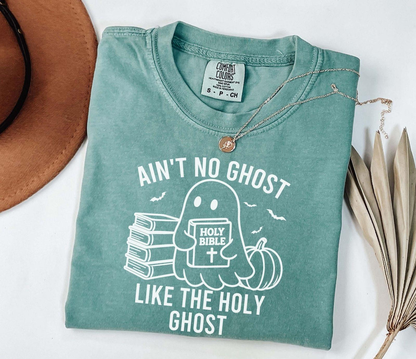 A comfort colors shirt with the saying "ain't no ghost like the holy ghost"