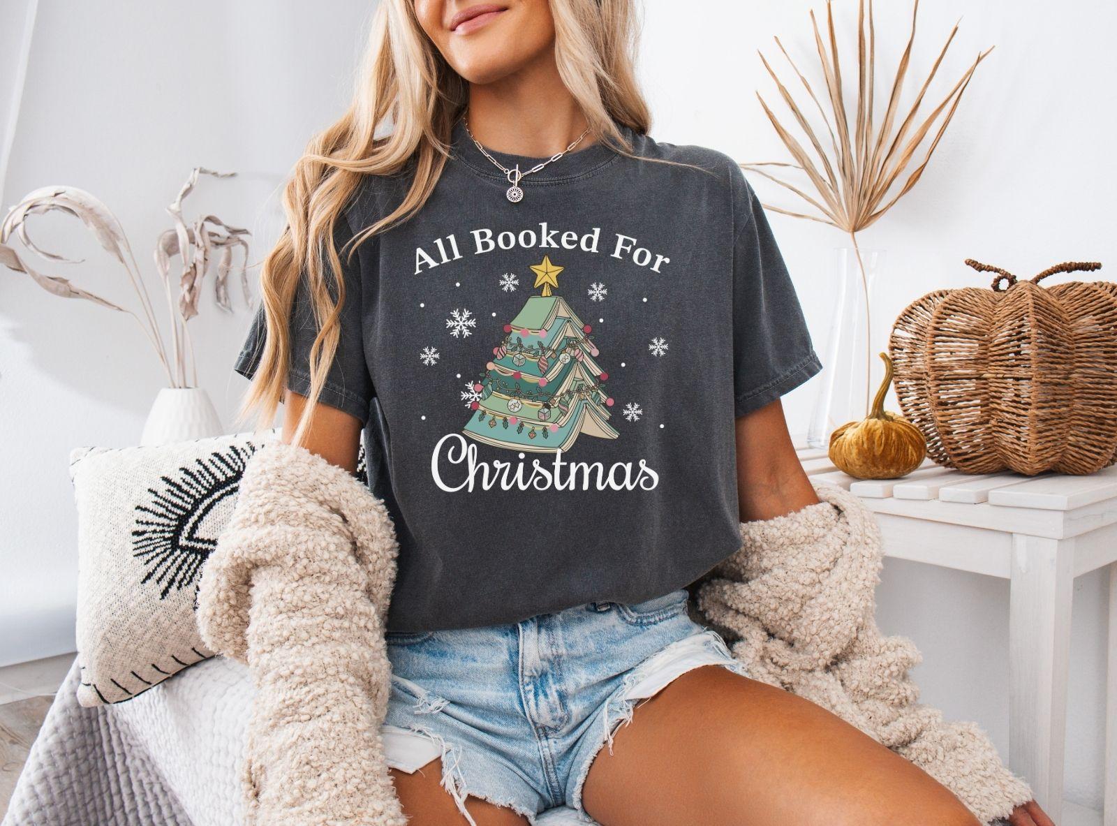 A comfort colors® shirt with the saying "All booked for Christmas"