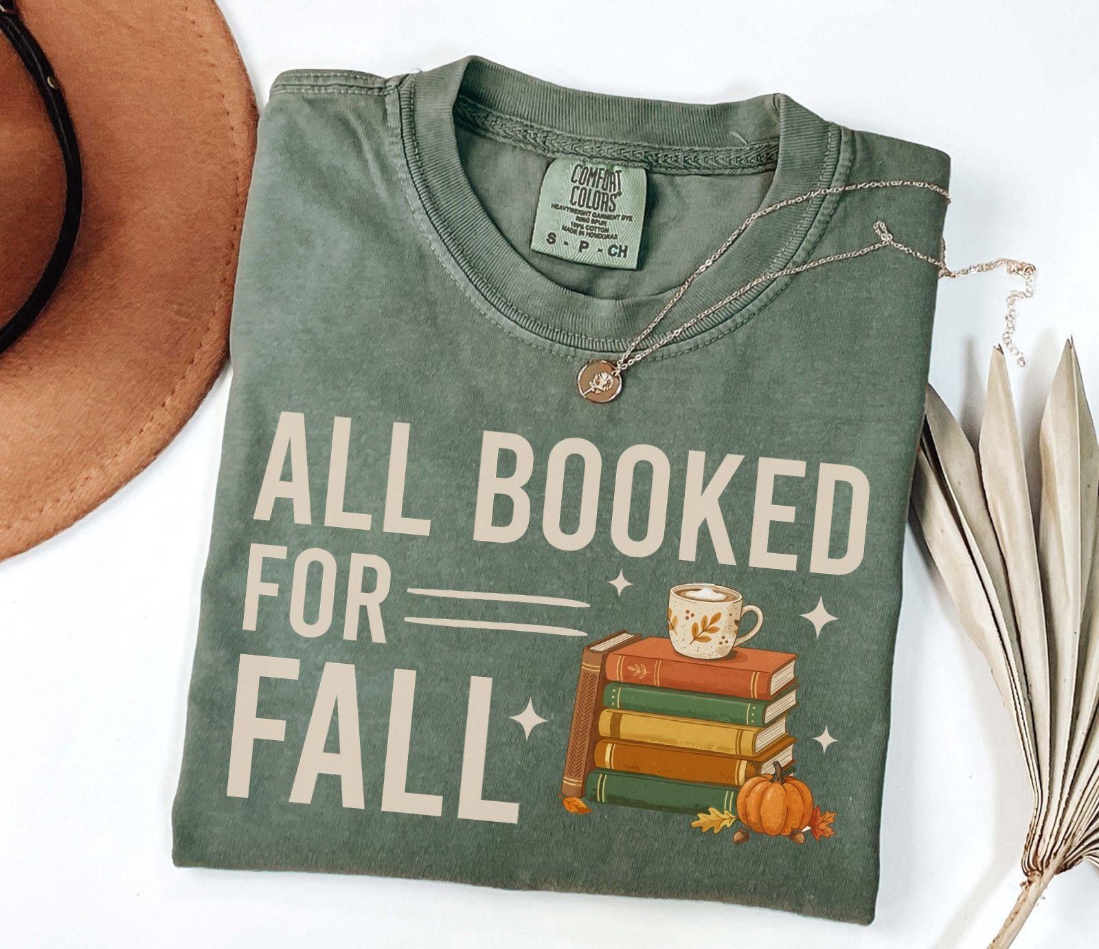 A comfort colors® shirt with the saying "all booked for fall"