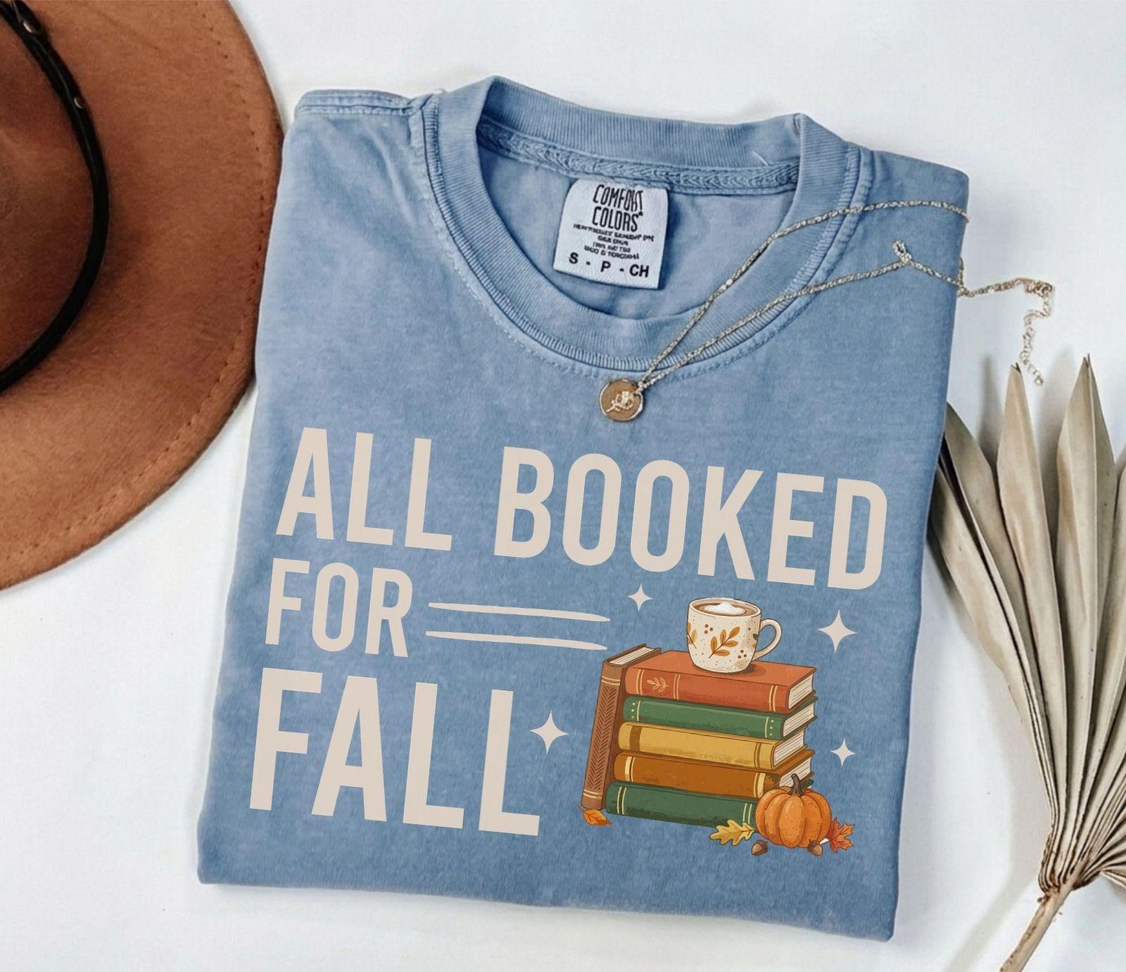 A comfort colors® shirt with the saying "all booked for fall"