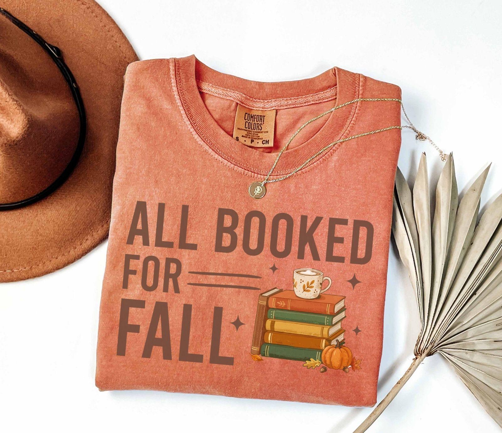 A comfort colors® shirt with the saying "all booked for fall"