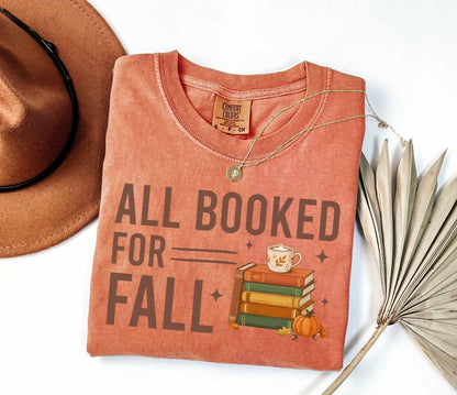 A comfort colors® shirt with the saying "all booked for fall"