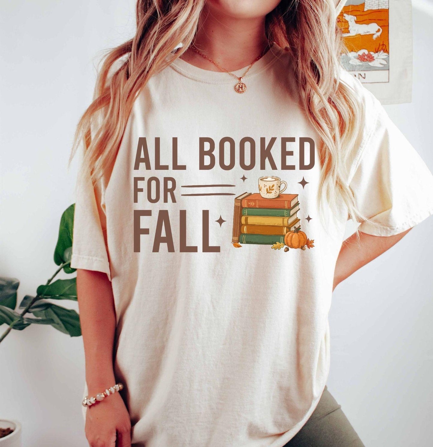 A comfort colors® shirt with the saying "all booked for fall"