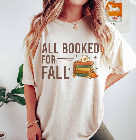 A comfort colors® shirt with the saying "all booked for fall"