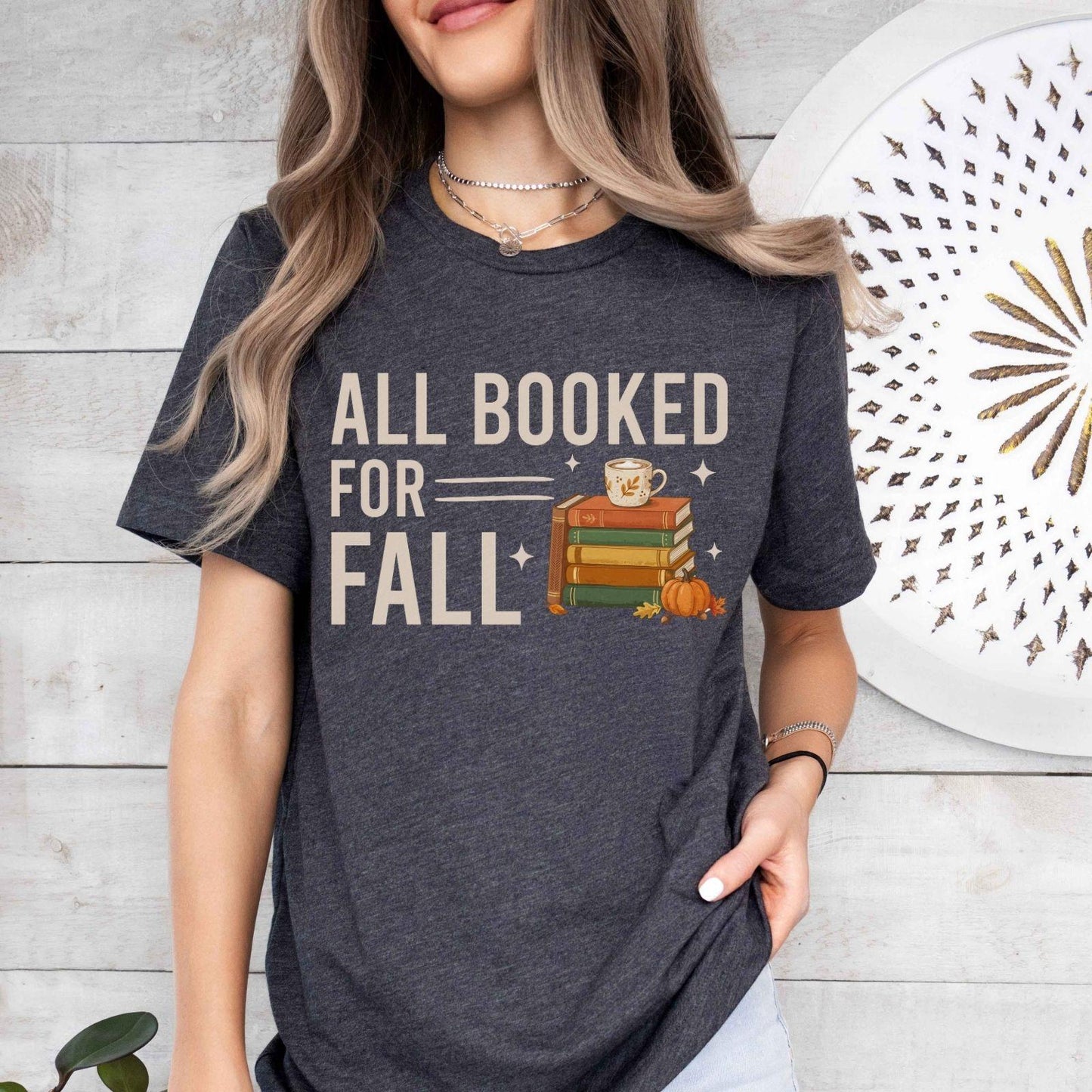 A bella canvas 3001 shirt with the saying "all booked for fall"