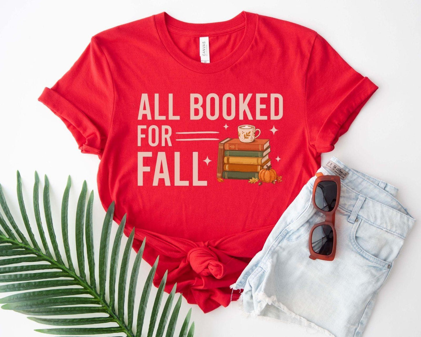 A bella canvas 3001 shirt with the saying "all booked for fall"