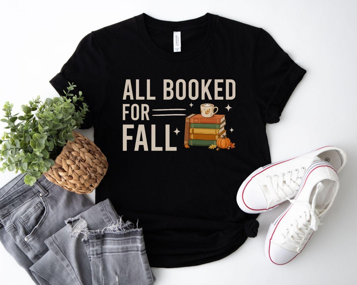 A bella canvas 3001 shirt with the saying "all booked for fall"