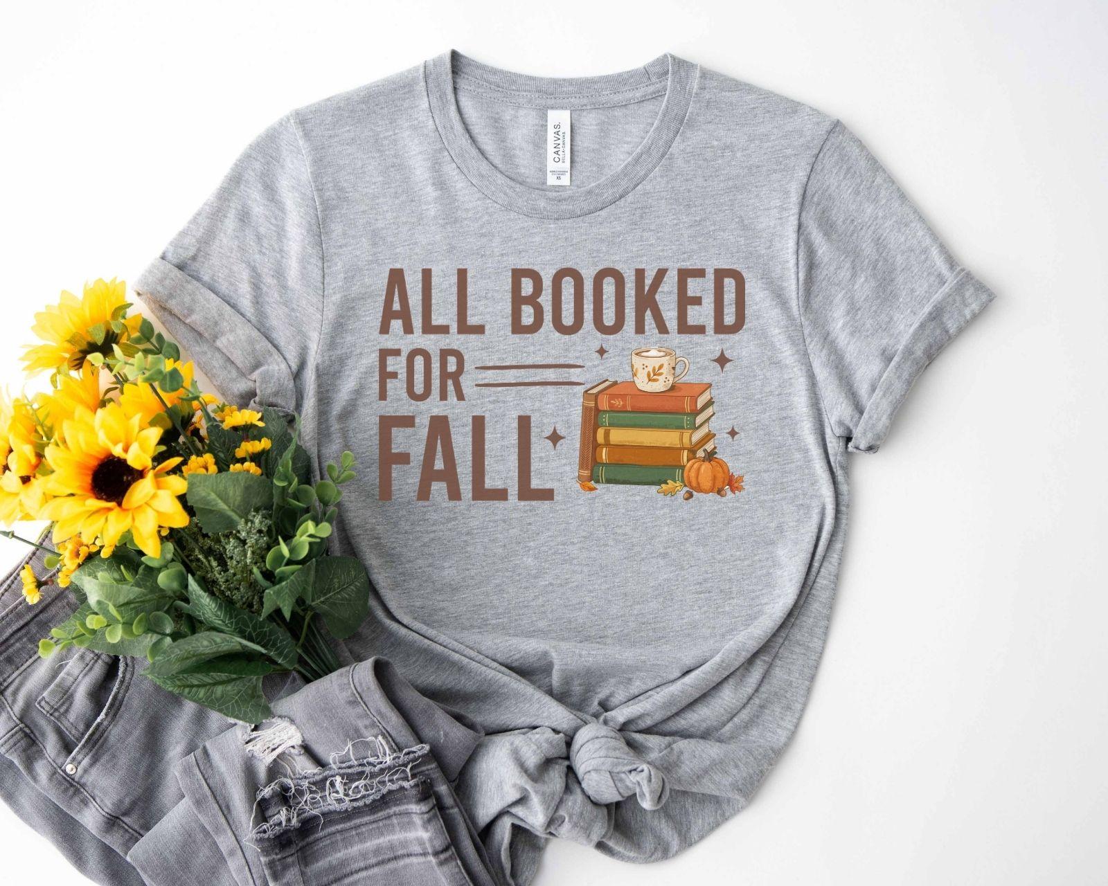 A bella canvas 3001 shirt with the saying "all booked for fall"