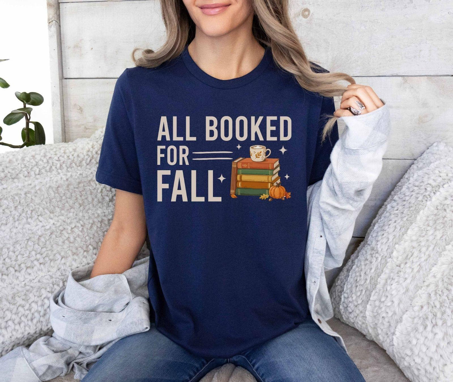 A bella canvas 3001 shirt with the saying "all booked for fall"