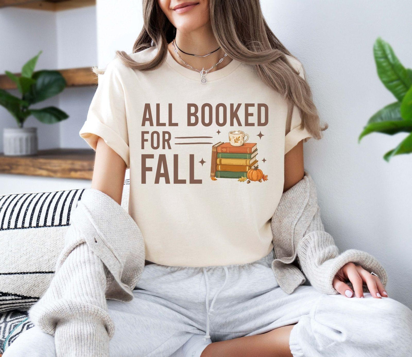 A bella canvas 3001 shirt with the saying "all booked for fall"
