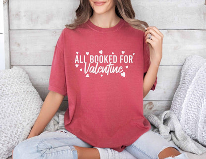 A comfort colors® shirt with the saying "all booked for valentine"
