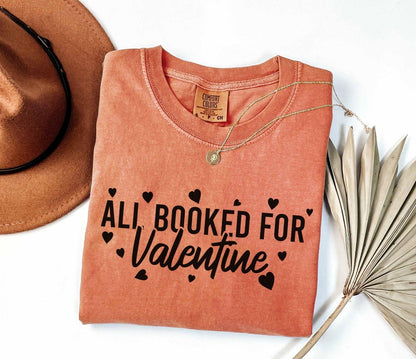 A comfort colors® shirt with the saying "all booked for valentine"