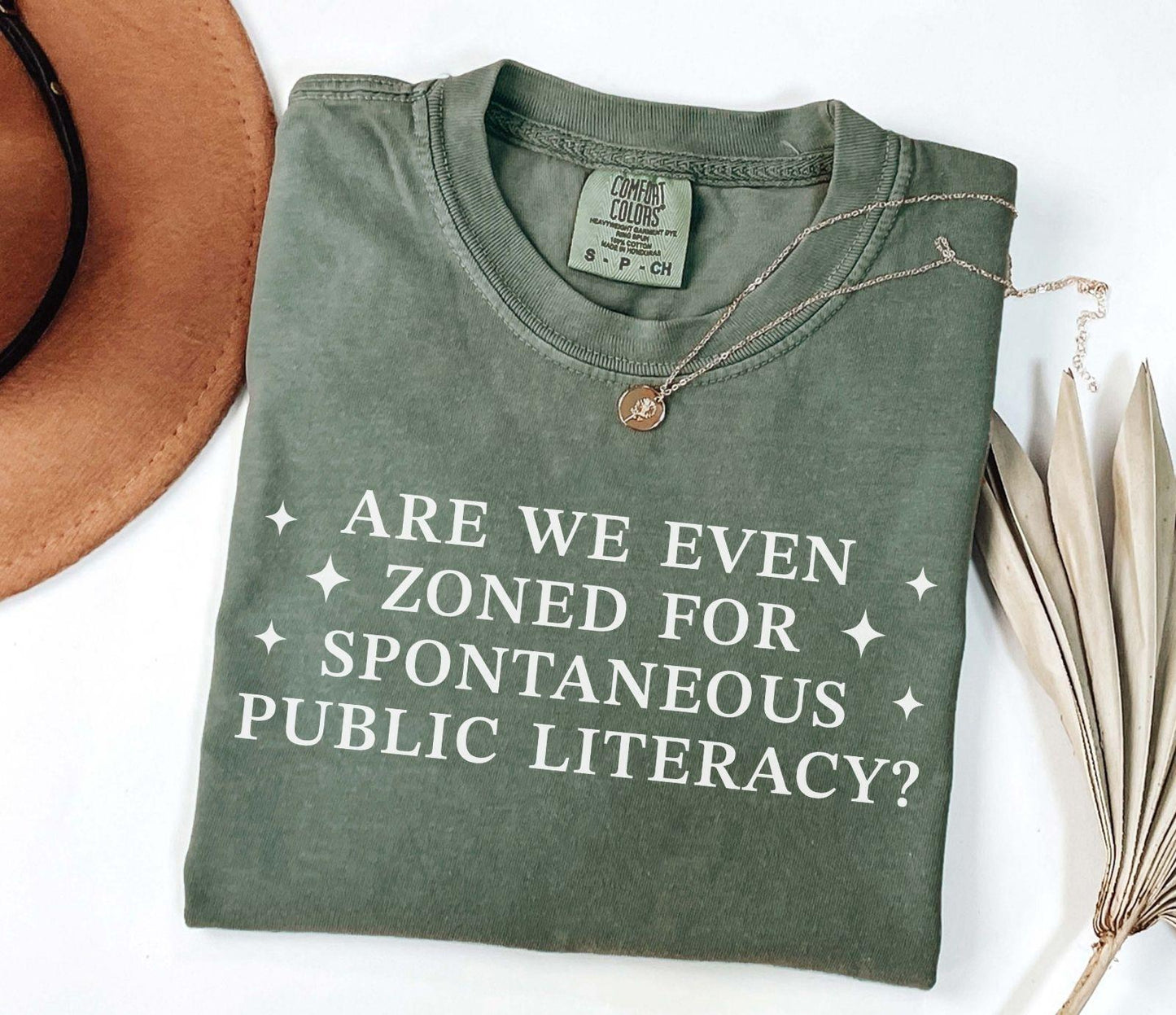 A comfort colors® shirt with the saying "Are We Even Zoned For Spontaneous Public Literacy"