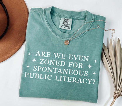 A comfort colors® shirt with the saying "Are We Even Zoned For Spontaneous Public Literacy"