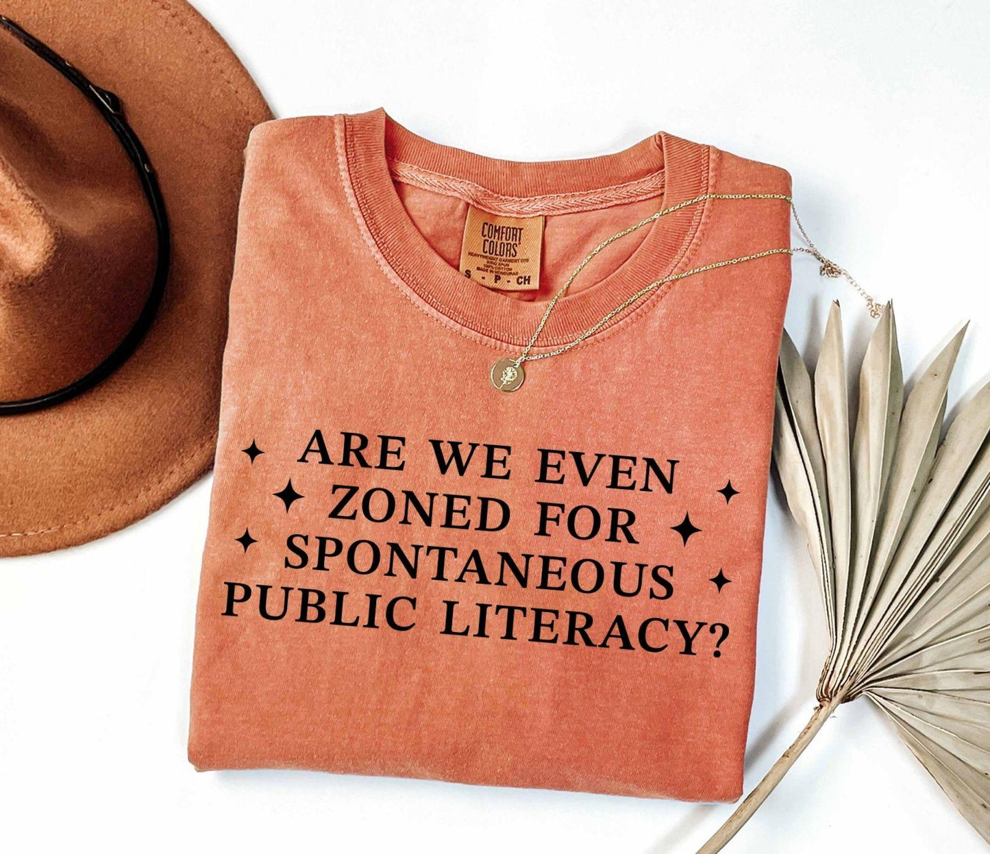 A comfort colors® shirt with the saying "Are We Even Zoned For Spontaneous Public Literacy"