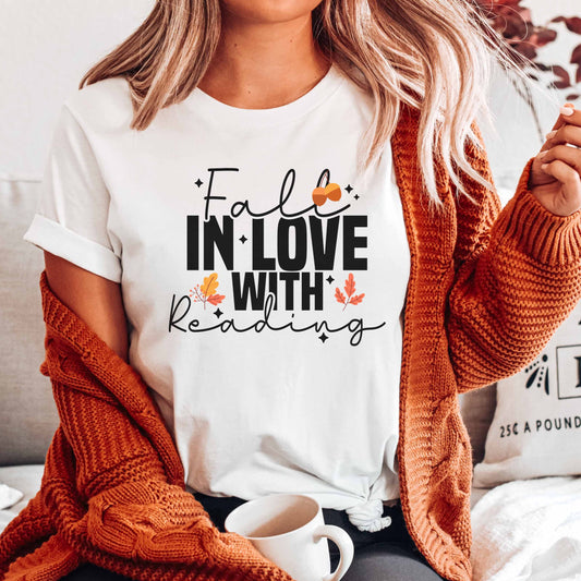 A white color shirt with the saying "Fall in love with reading"