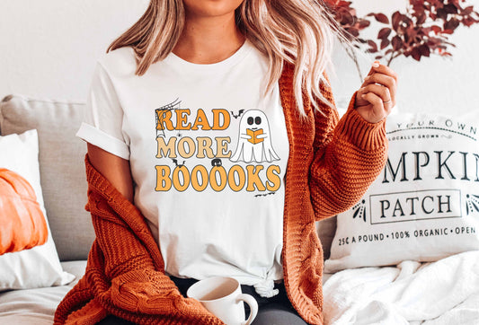 A white color shirt with the saying "Read More Boooks"
