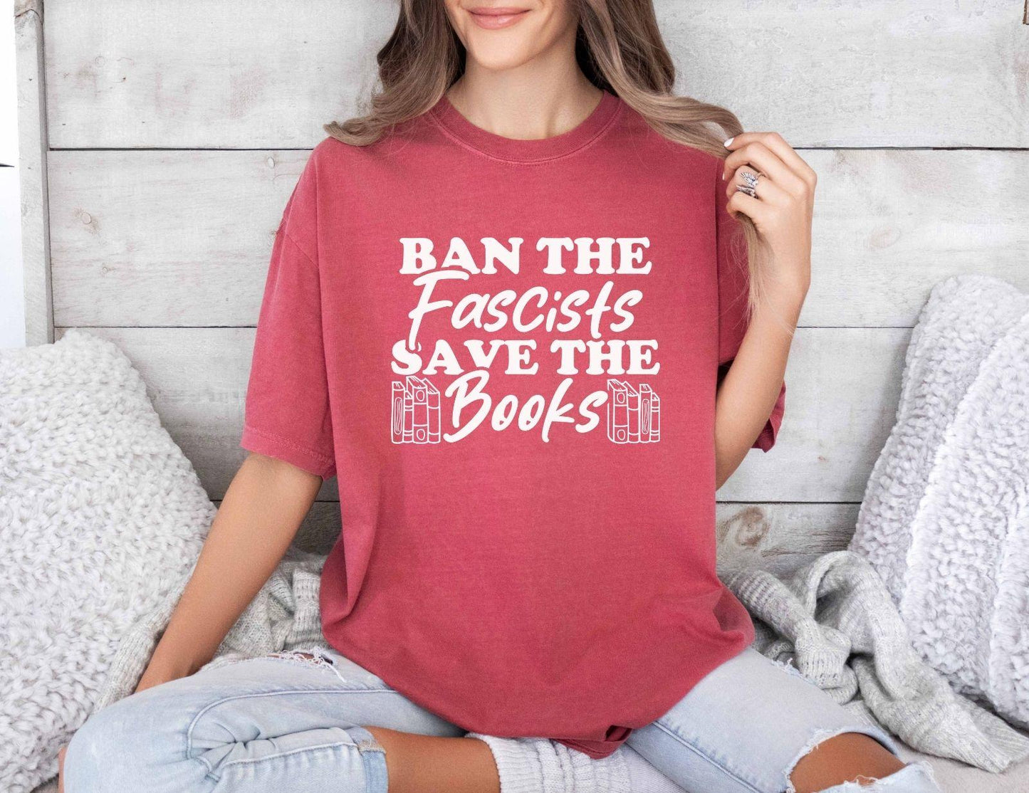 A comfort colors shirt with the saying "Ban the fascists save the books"