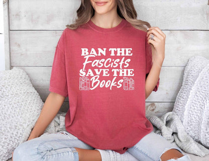 A comfort colors shirt with the saying "Ban the fascists save the books"