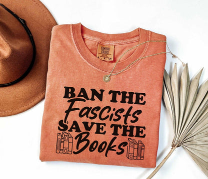 A comfort colors shirt with the saying "Ban the fascists save the books"