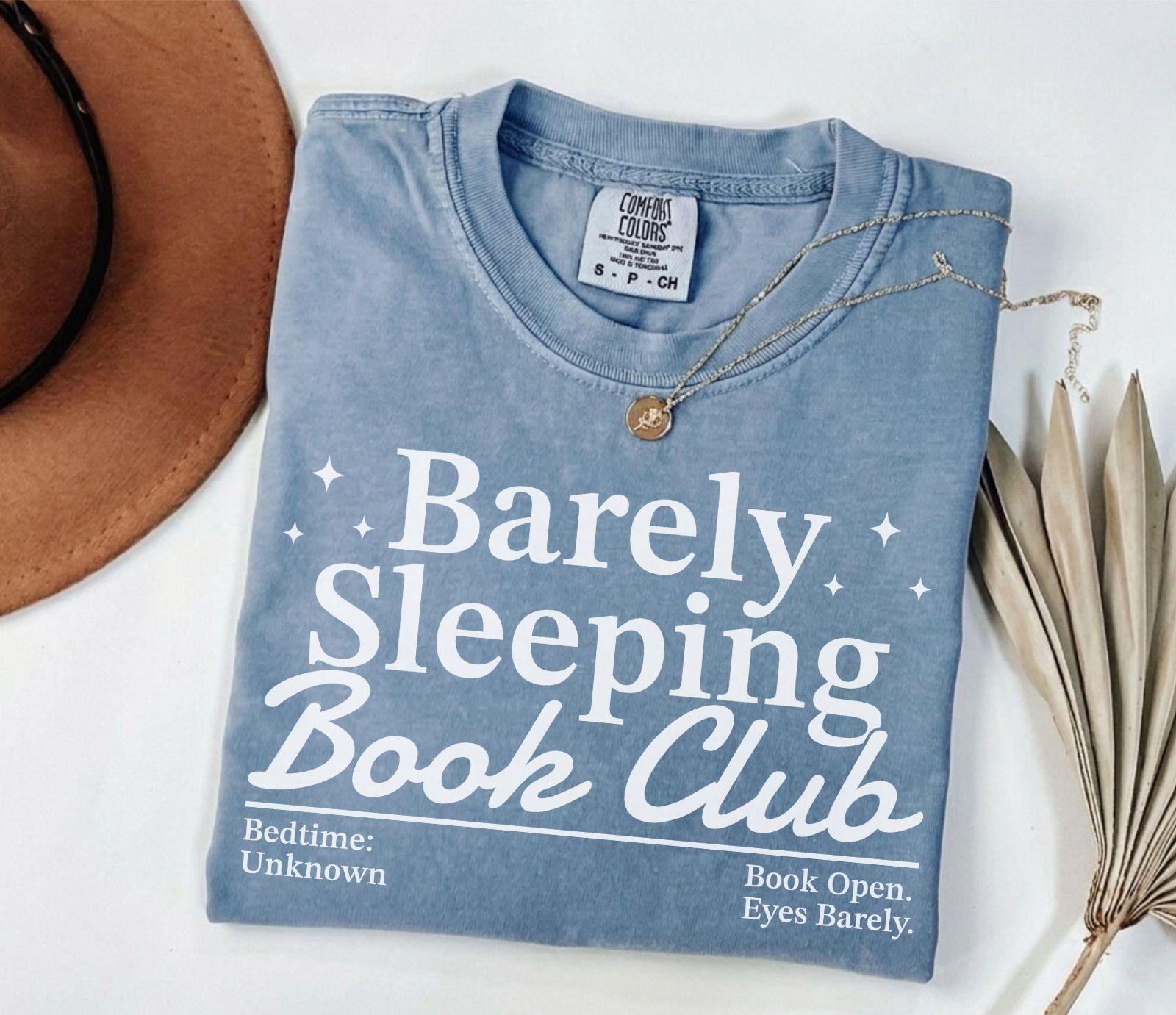 A comfort colors® shirt with the saying "barely sleeping book club"