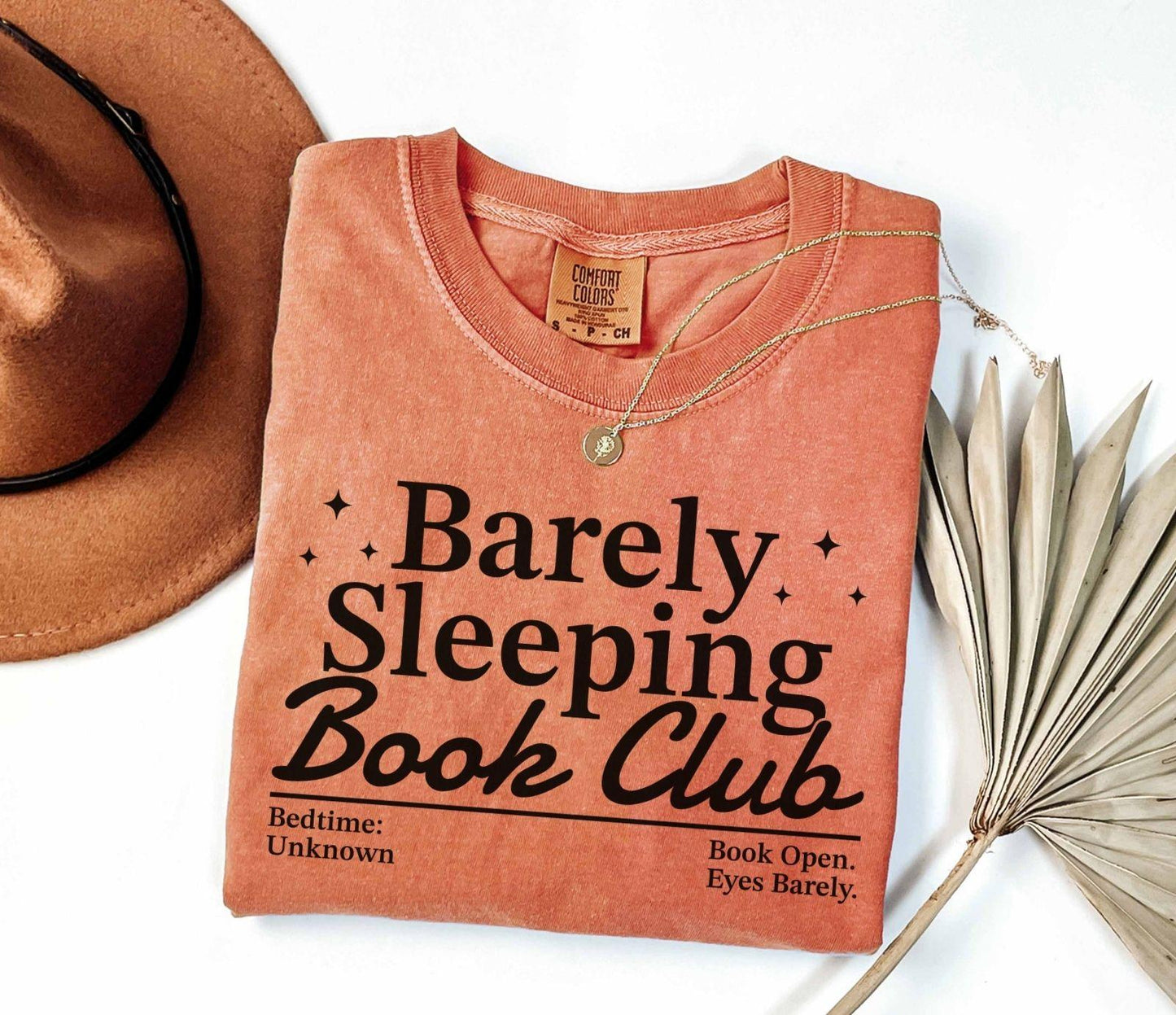 A comfort colors® shirt with the saying "barely sleeping book club"