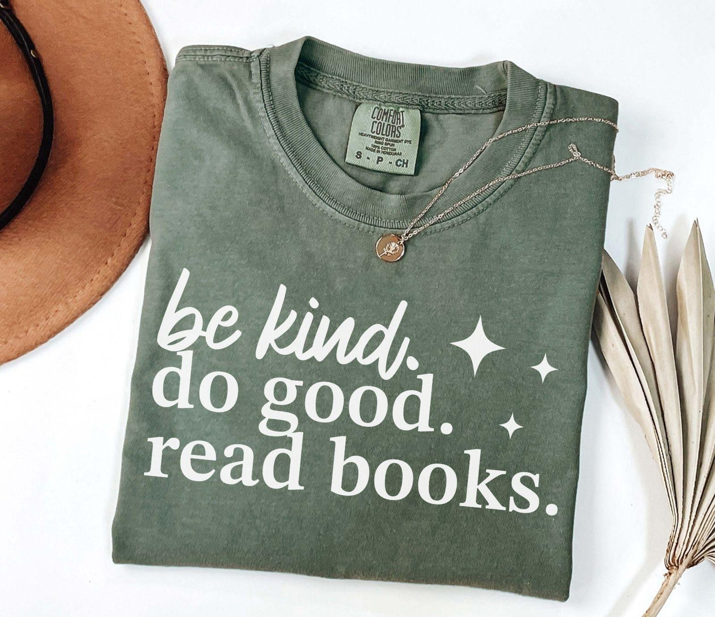 A comfort colors® shirt with the saying "be kind do good read books"
