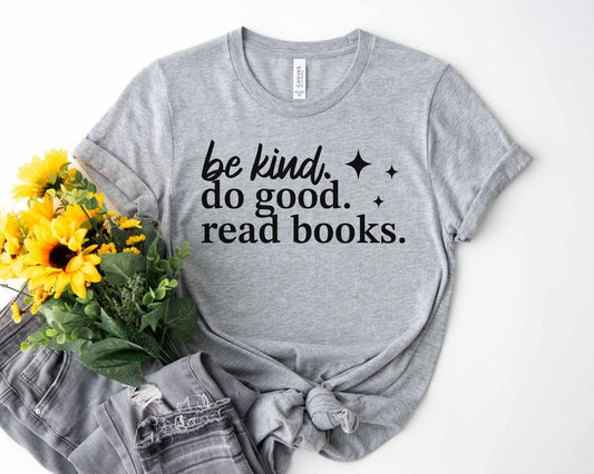 A bella canvas 3001 shirt with the saying "be kind do good read books"