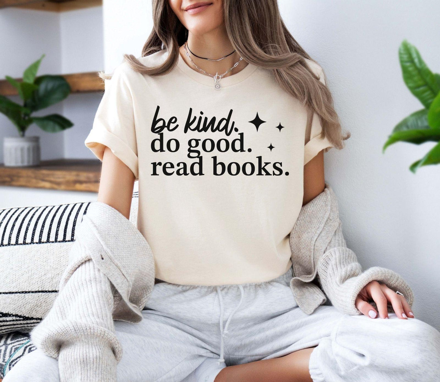 A bella canvas 3001 shirt with the saying "be kind do good read books"