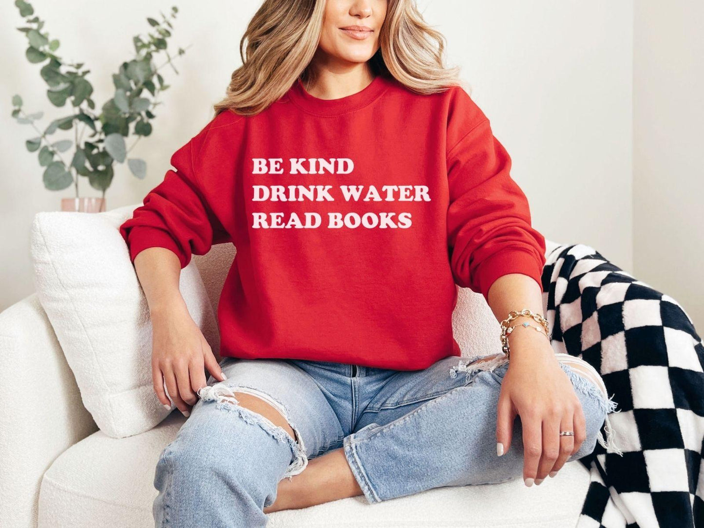 A Gildan 18000 sweatshirt with the saying "be kind drink water read books"