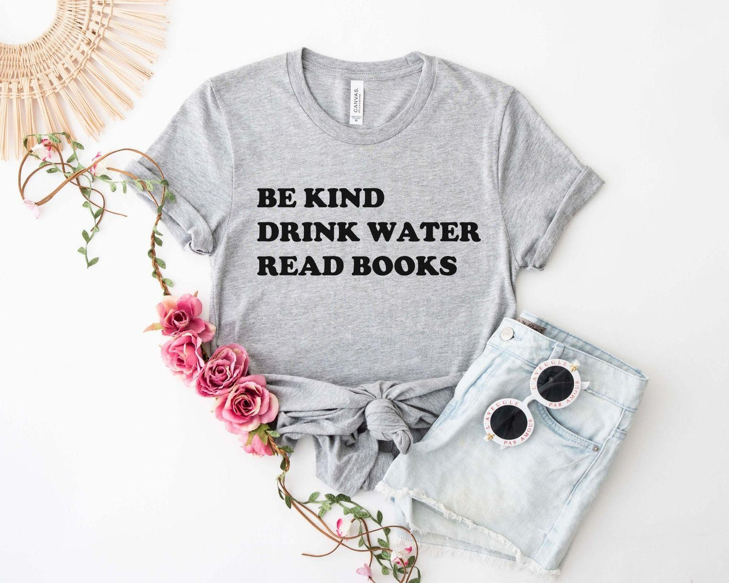 A comfort colors® shirt with the saying "be kind drink water read books"