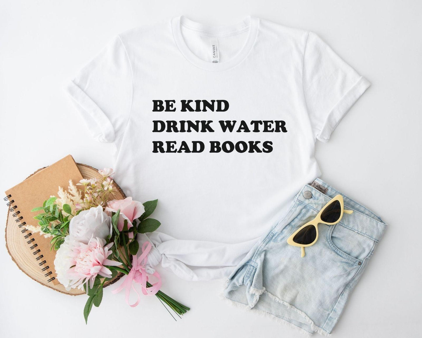 A comfort colors® shirt with the saying "be kind drink water read books"