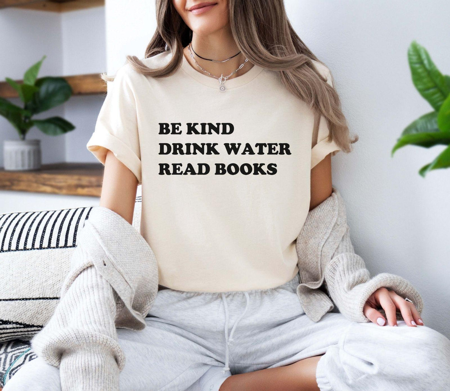 A comfort colors® shirt with the saying "be kind drink water read books"