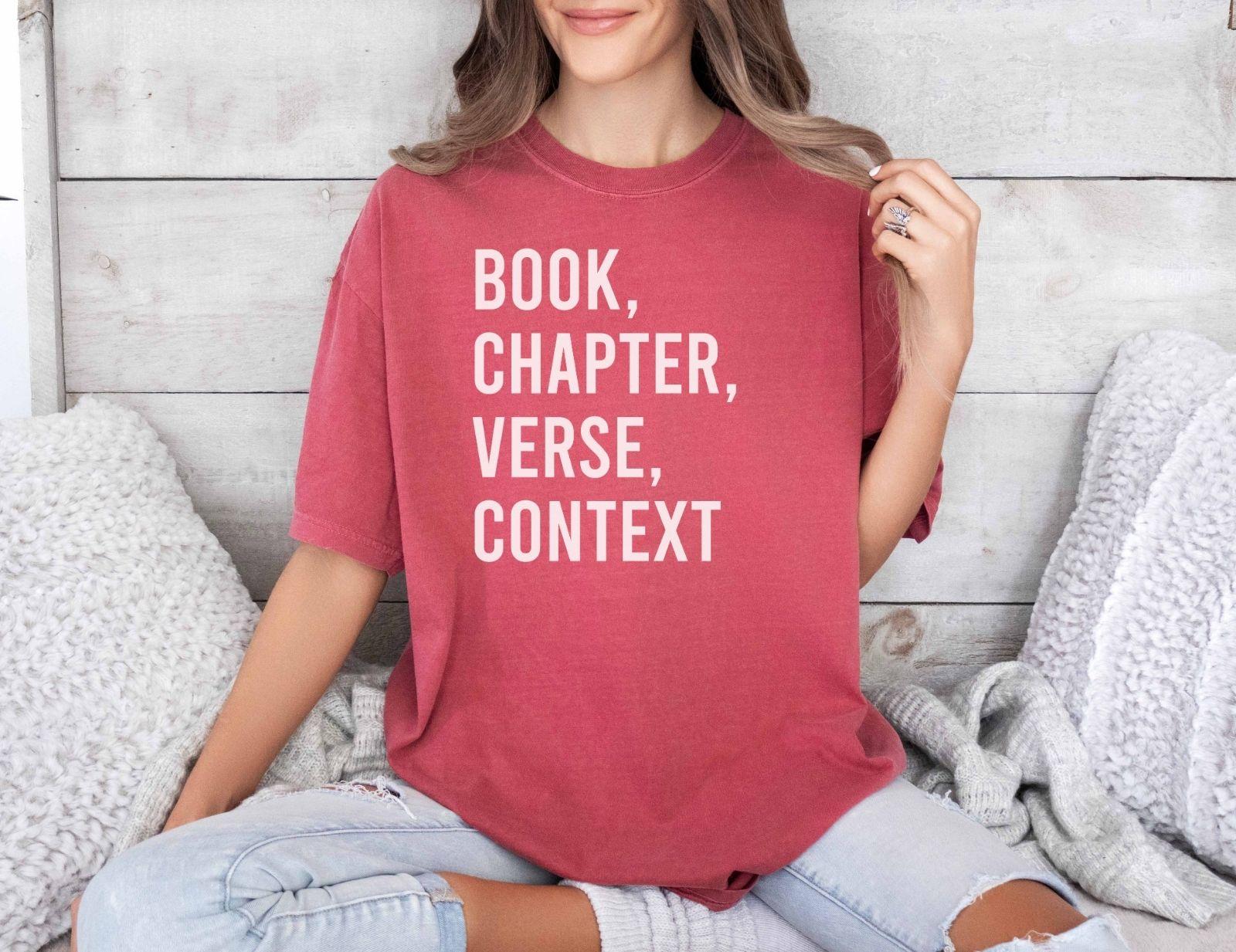 A comfort colors® shirt with the saying "book chapter verse context"