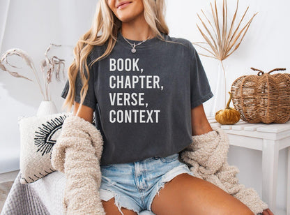 A comfort colors® shirt with the saying "book chapter verse context"