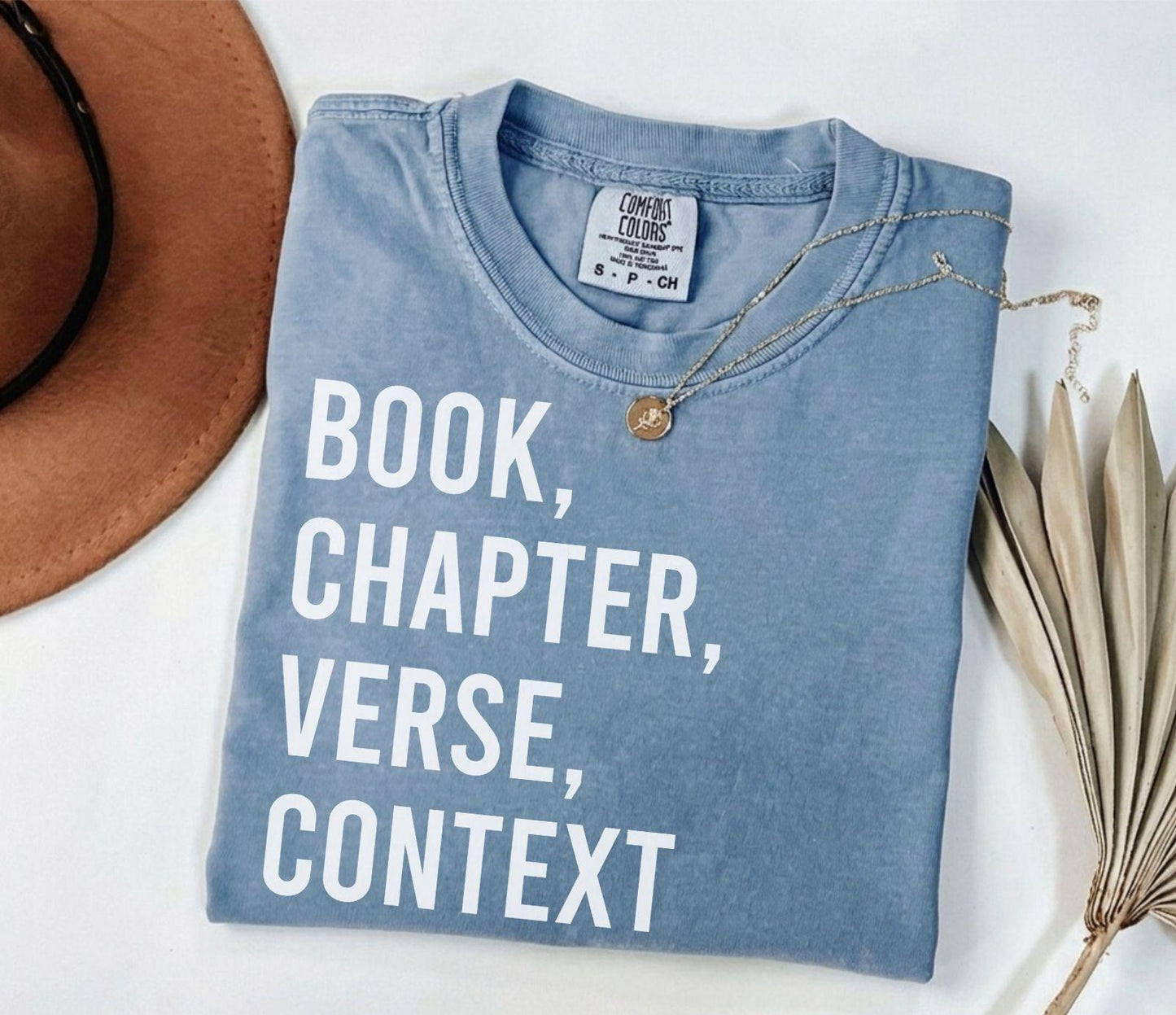A comfort colors® shirt with the saying "book chapter verse context"