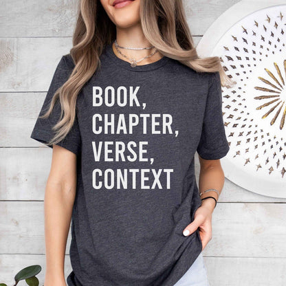 A bella canvas 3001 shirt with the saying "book chapter verse context"