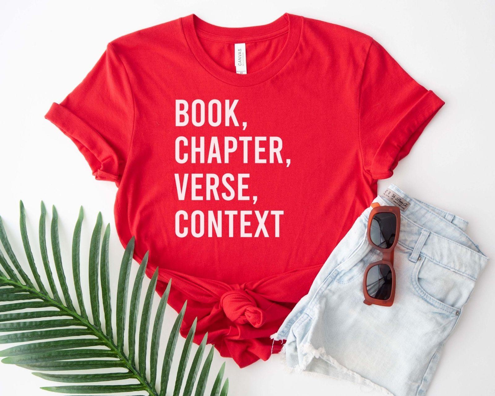 A bella canvas 3001 shirt with the saying "book chapter verse context"