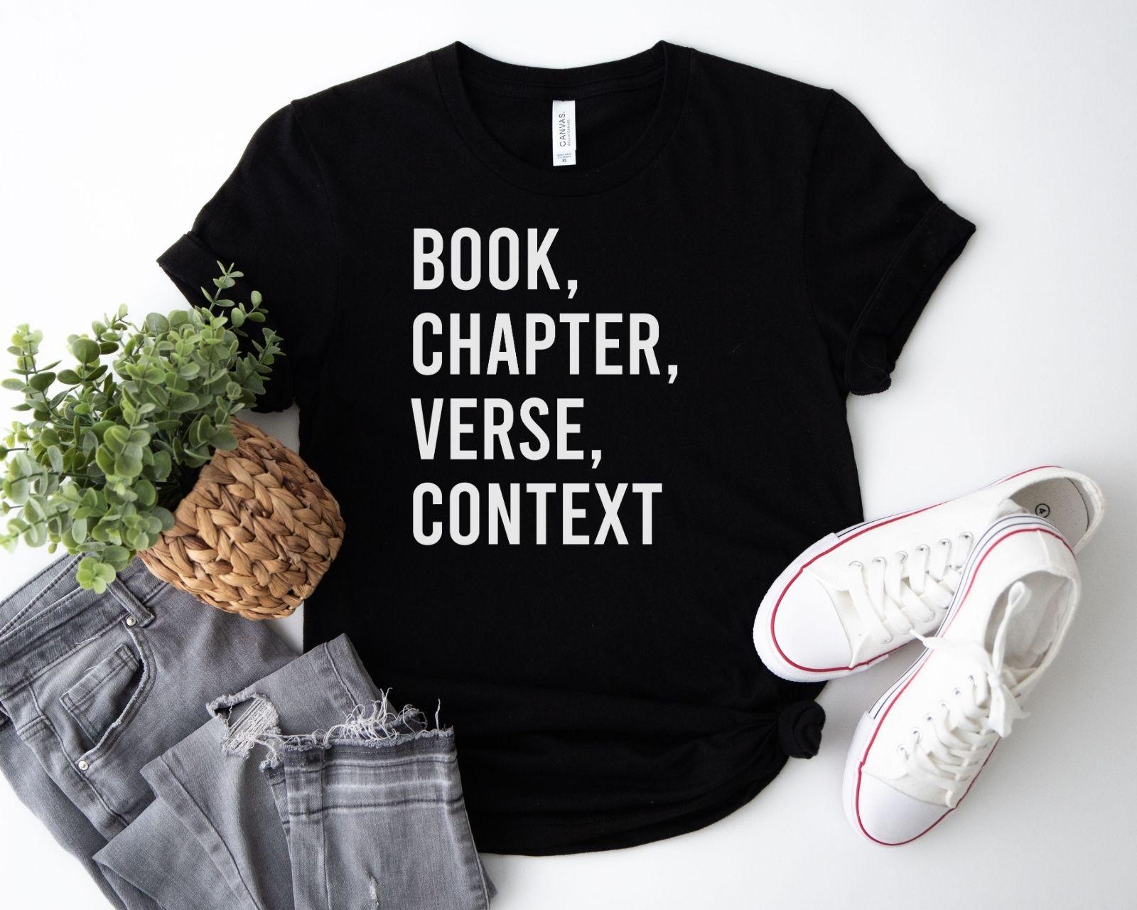 A bella canvas 3001 shirt with the saying "book chapter verse context"