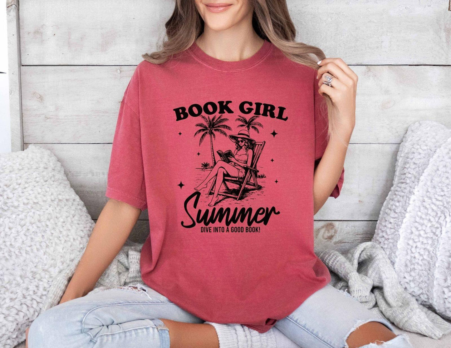 A comfort colors shirt with the saying "book girl summer dive into a good book"