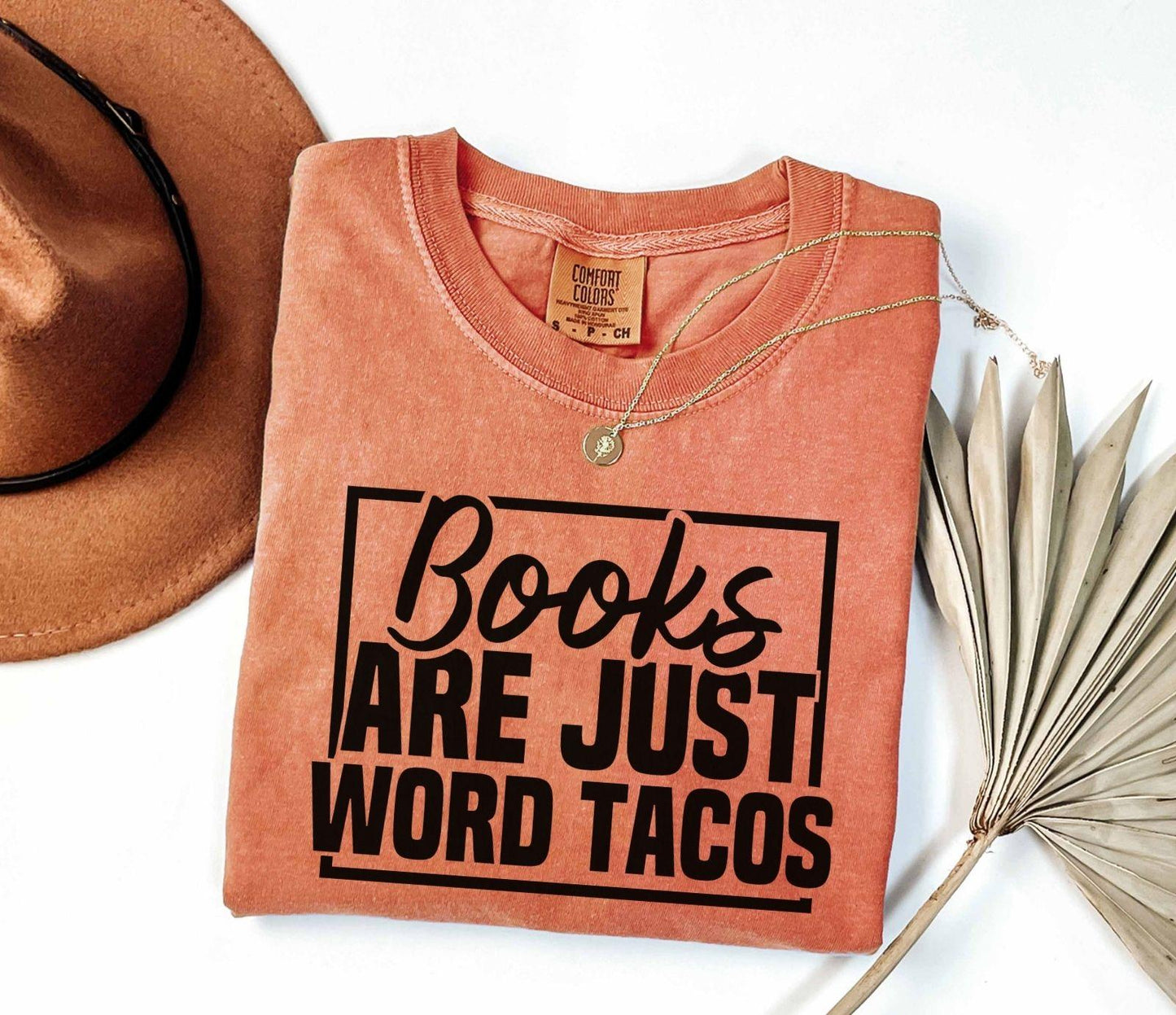 A comfort colors shirt with the saying "Books are just word tacos"