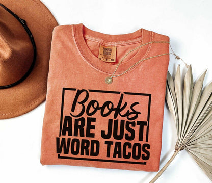 A comfort colors shirt with the saying "Books are just word tacos"
